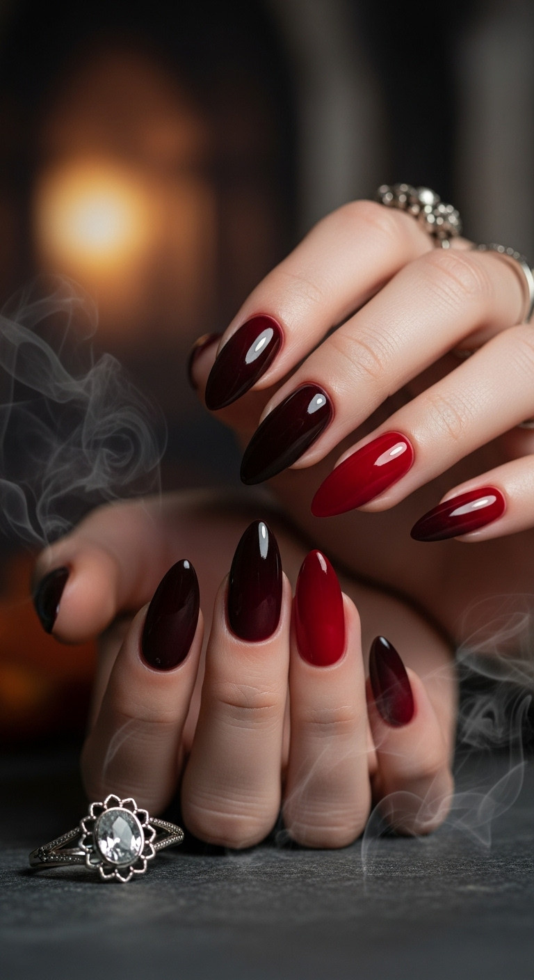 Eerie ombre red almond Halloween nails on stone with smoke and ring