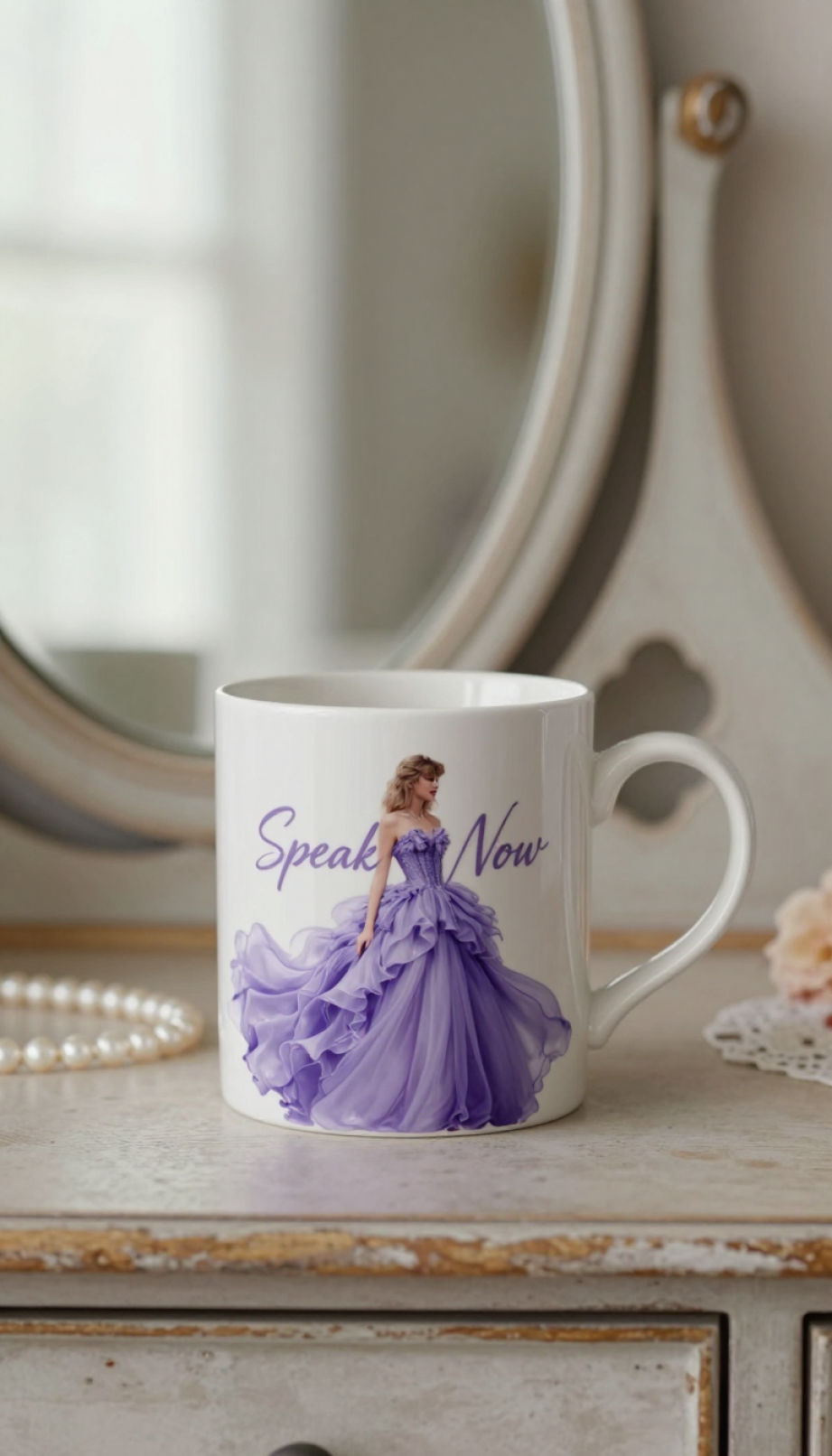 Speak Now album mug featuring delicate purple gown design with vintage pearls on wooden vanity